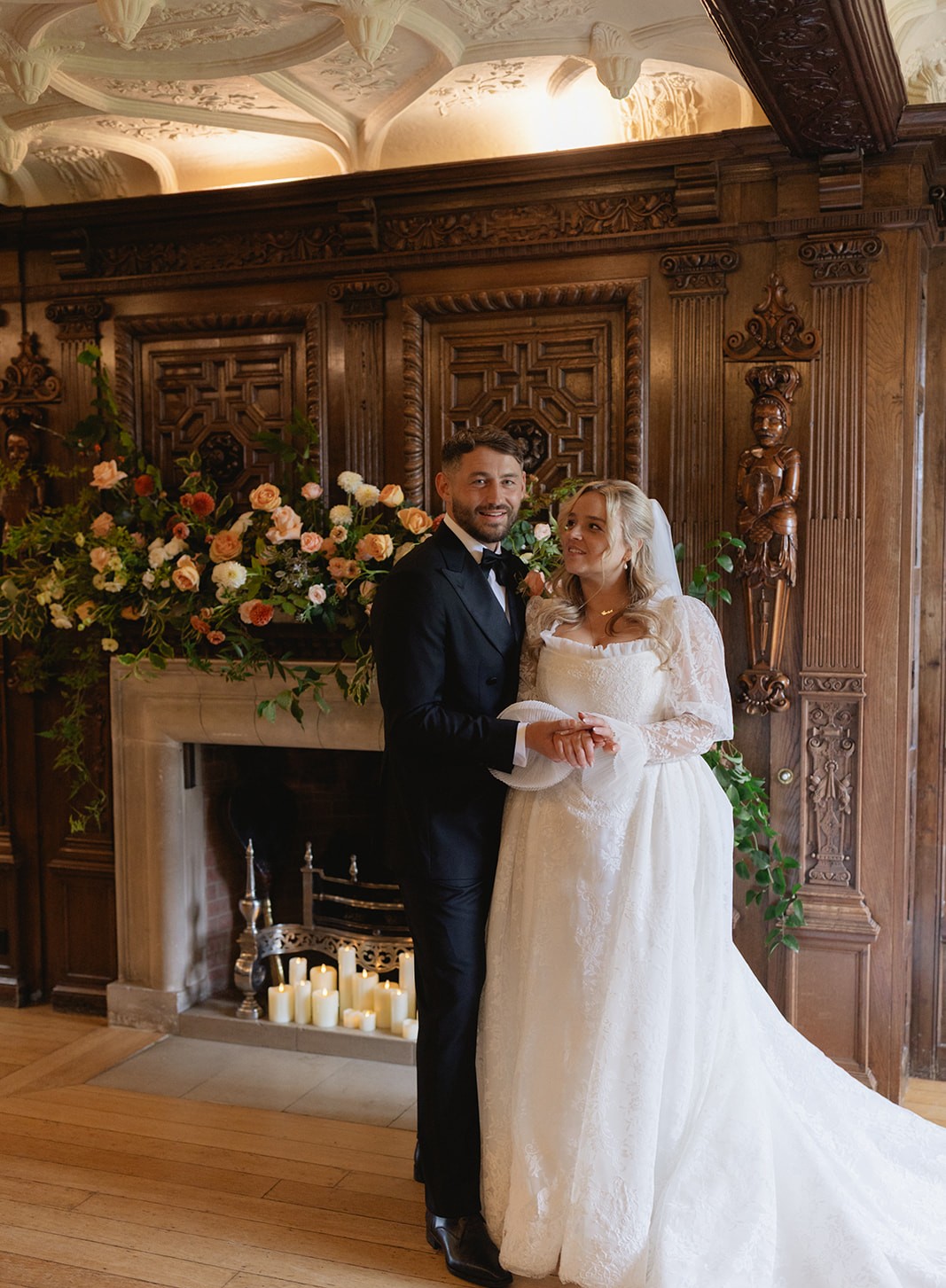 Studland Bay House - Couple by fireplace cropped