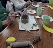 People making tealight holders