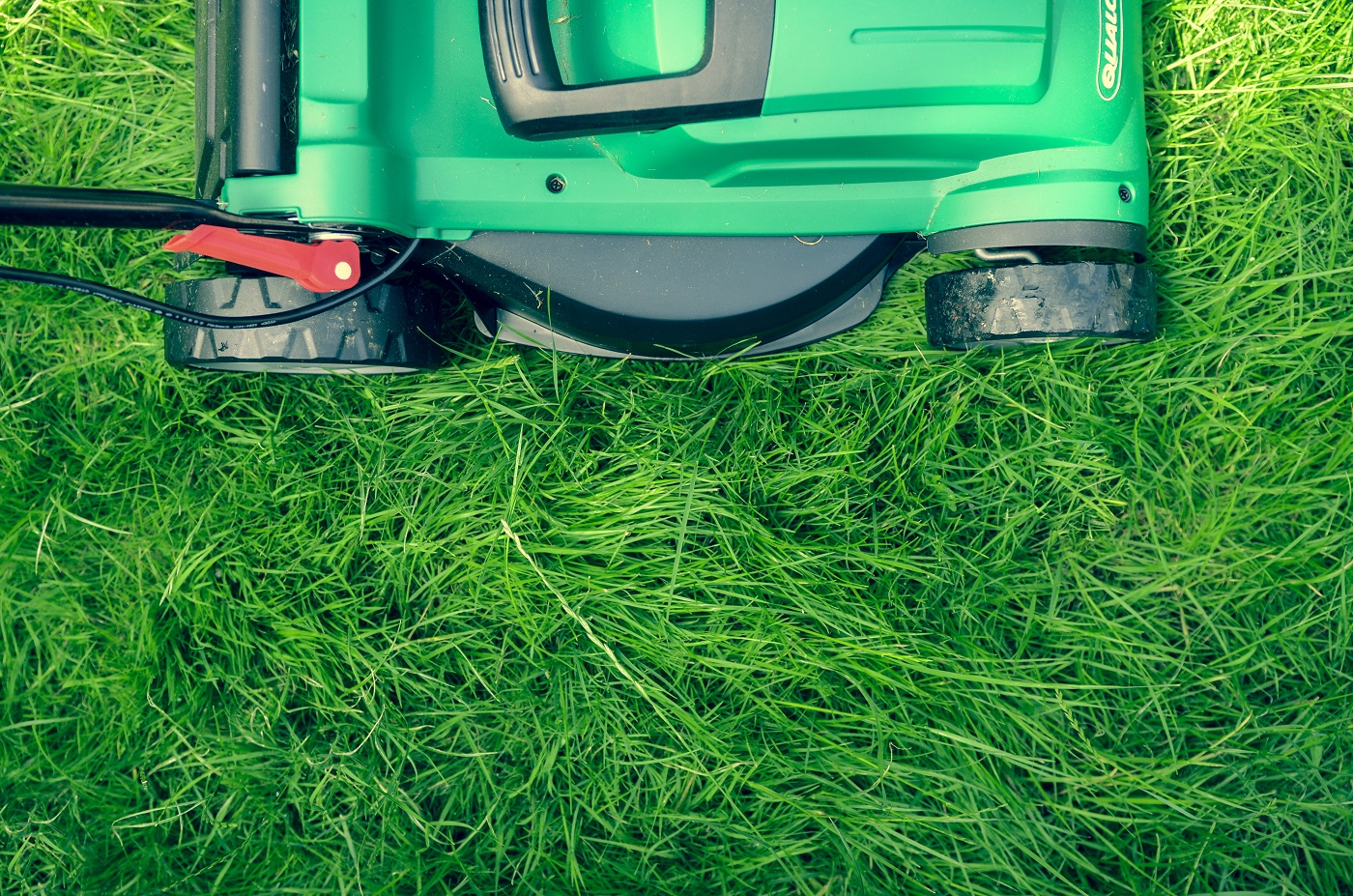 Lawnmower on green gras