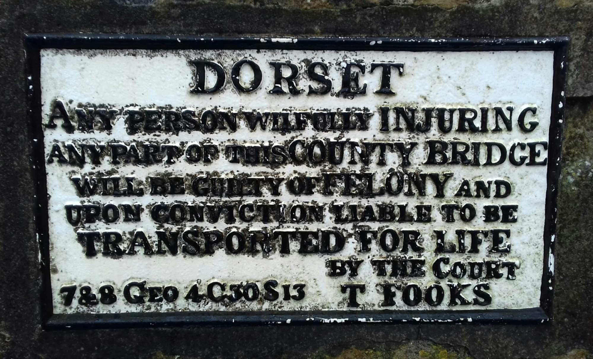 Transportation plaque on a bridge