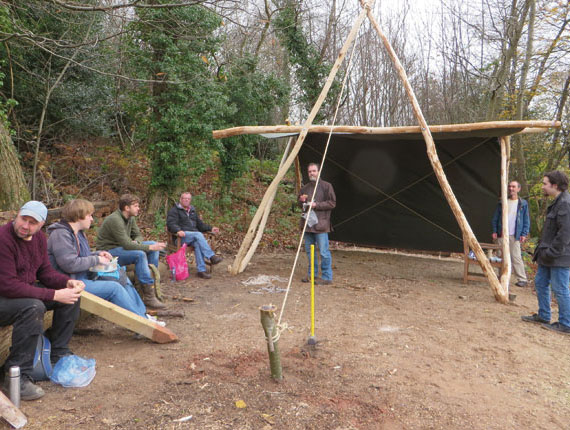 Visitors admire their completed shelter and take a well earned rest