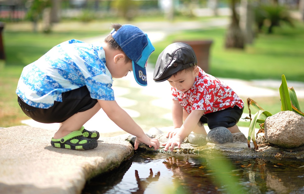 Children playing near pond