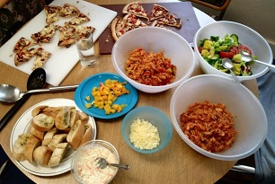 Bowls and plates of food on a table