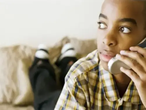 This is an image of a person talking on a telephone.