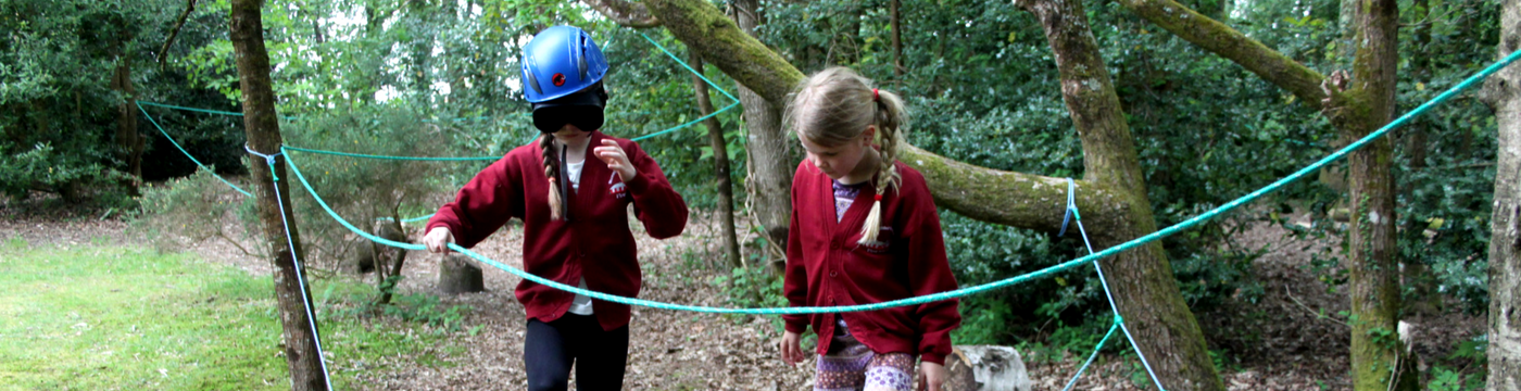 Two young girls on a blind fold trail