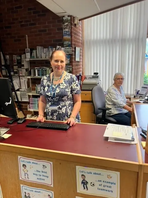 library staff behind the desk