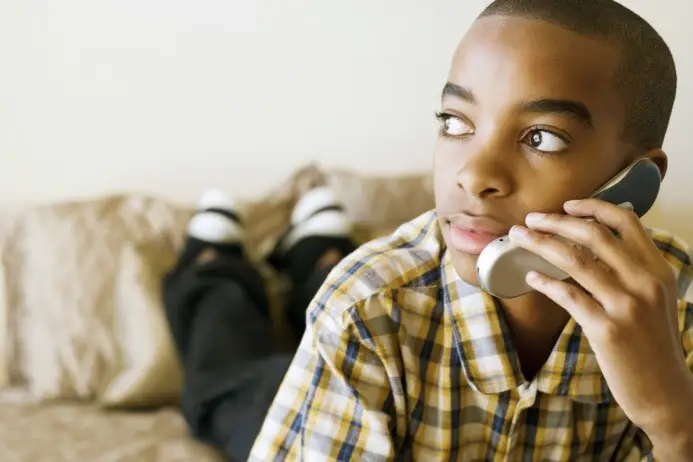 This is a picture of a child talking on the phone.