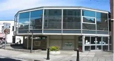 This is a picture of the front of Swanage Library with the entrance in the centre of image.