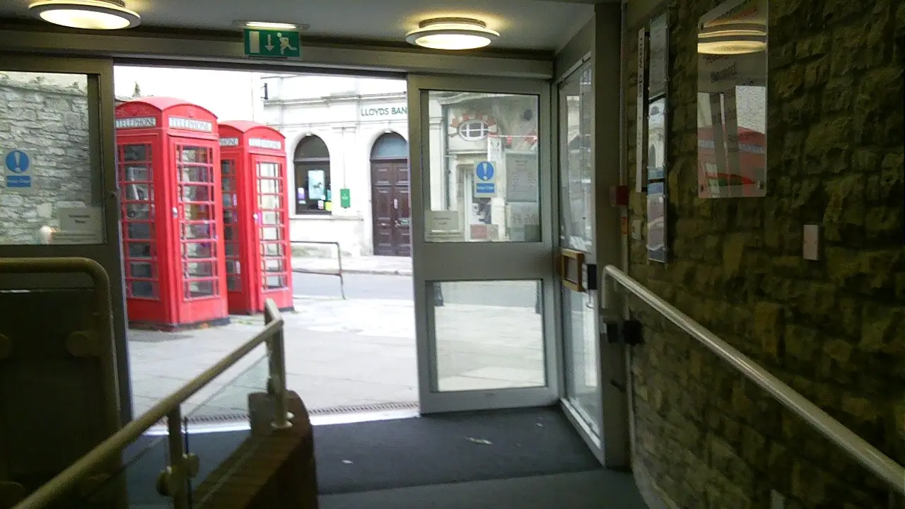 This is a picture of the exit to the library, there are rails to either side and the door is open.