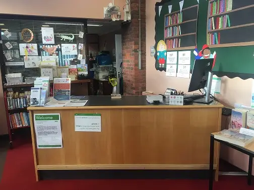 This is a picture of the front desk with computer screen and keyboard.