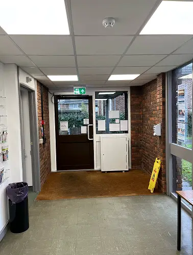 This is a picture of the exit door at the library.  There is a push button to the left which opens the door.
