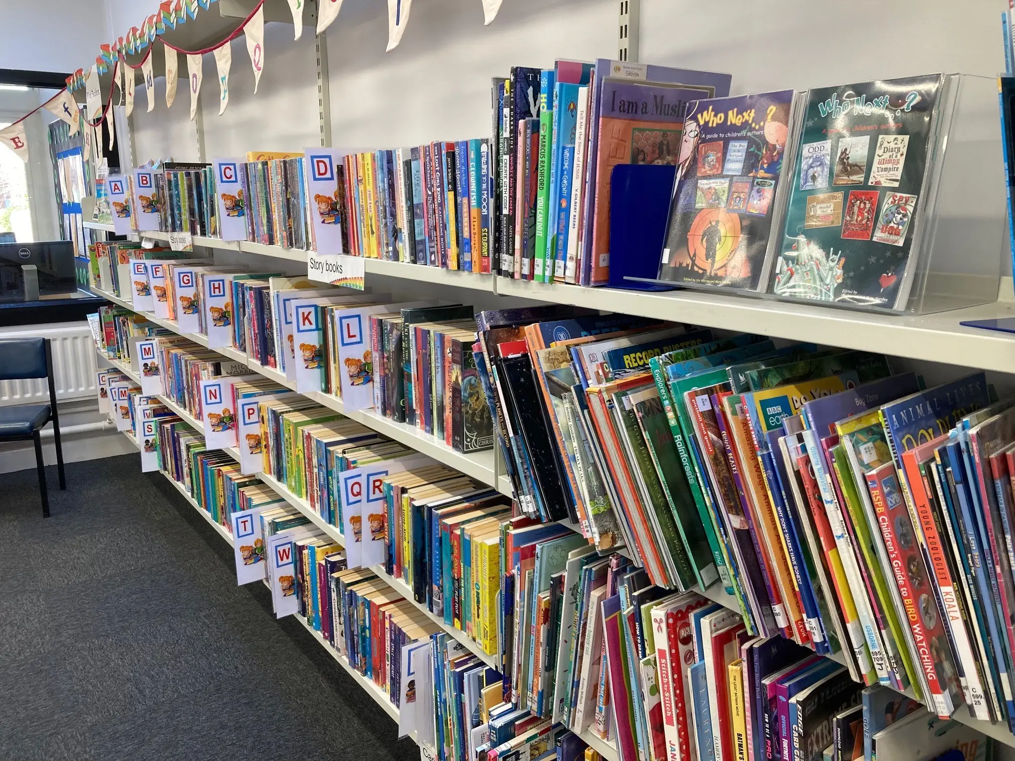 The is a picture of a large shelving unit full of books.