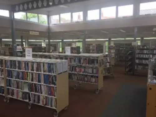 This is an image of rows of shelves containing books.