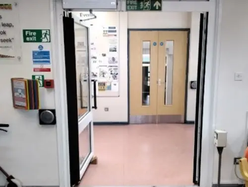 This is an image of the doors which are open to exit the building.