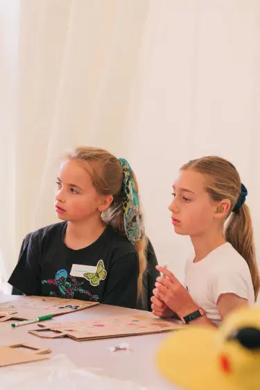 2 girls wearing hearing aids