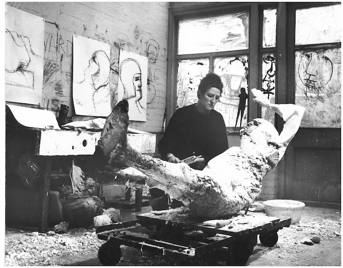 Elisabeth Frink working on a plaster sculpture ahead of casting into bronze