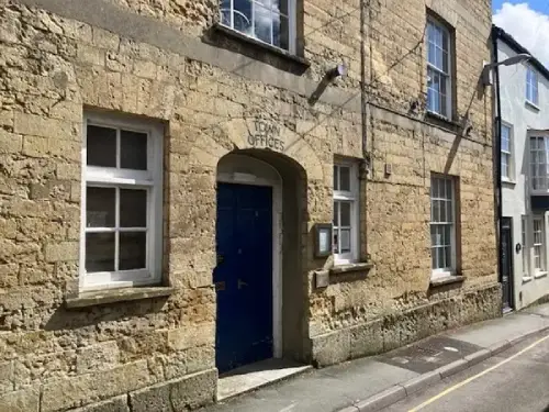 This is an image of the front door at Beaminster Library.  It is a stone building.