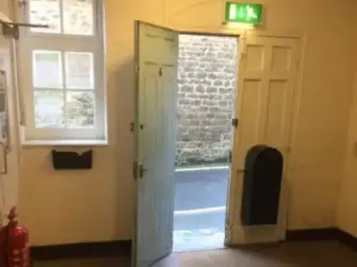 This is an image of the exit, it is an open door.