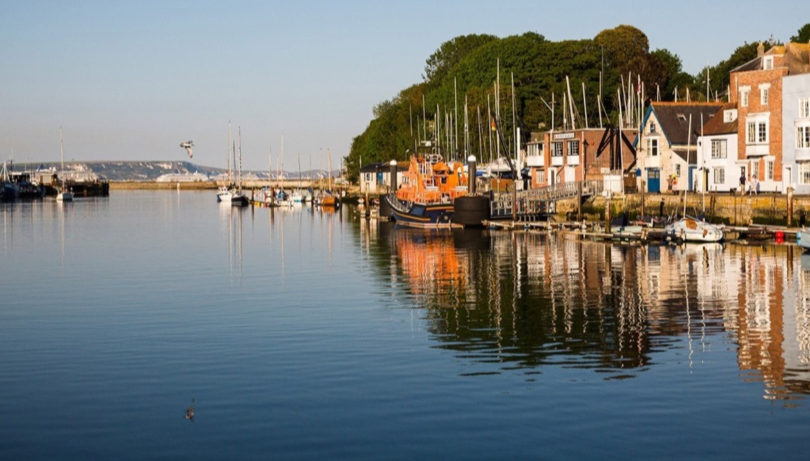Image of Weymouth harbour houses and boats in the harbour
