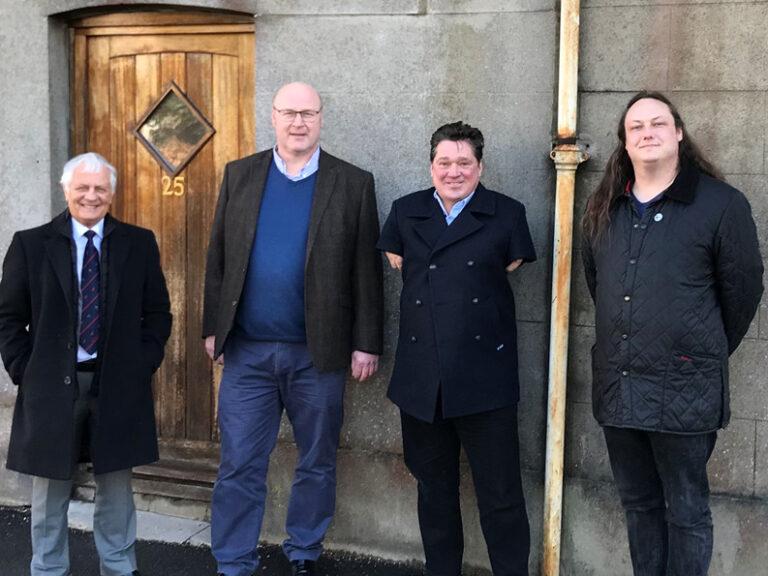 Picture shows visitors to the renovated property in Blandford Forum (l-r) Mike Lewis and Adam Perkins of the Blandford Freemasons with Cllr Graham Carr-Jones, Portfolio Holder for Housing and Cllr Nocturin Lacey-Clarke, Blandford Ward, outside the new ho