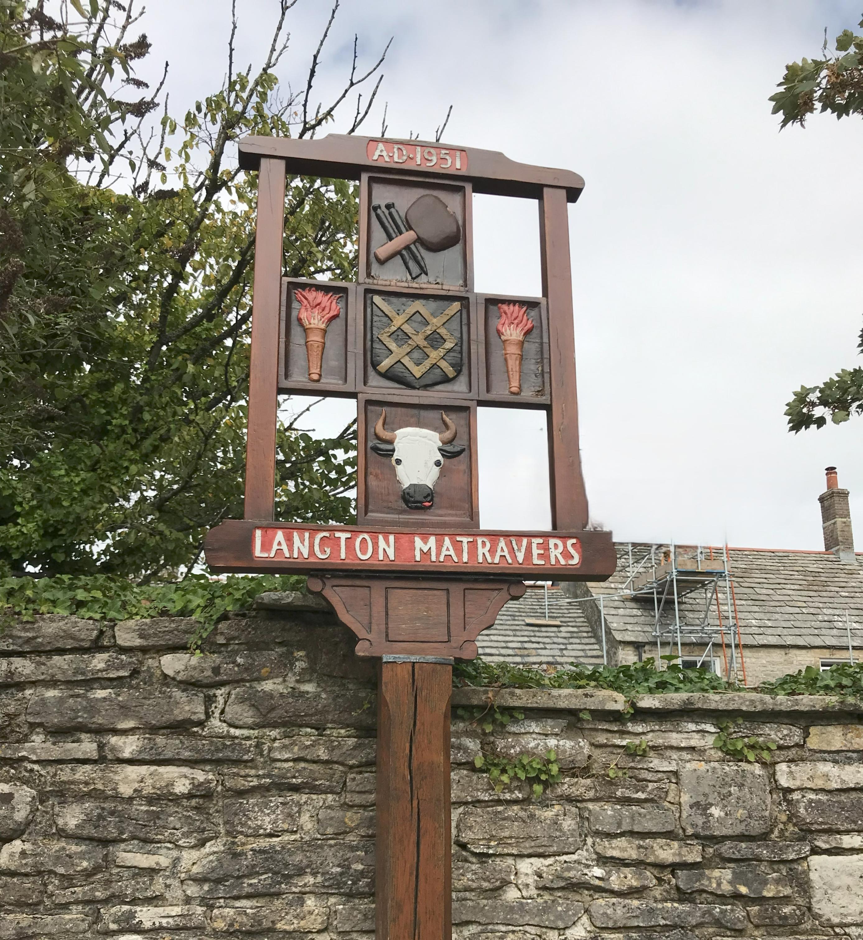 This is an image of a decorative village signpost for Langton Matravers,