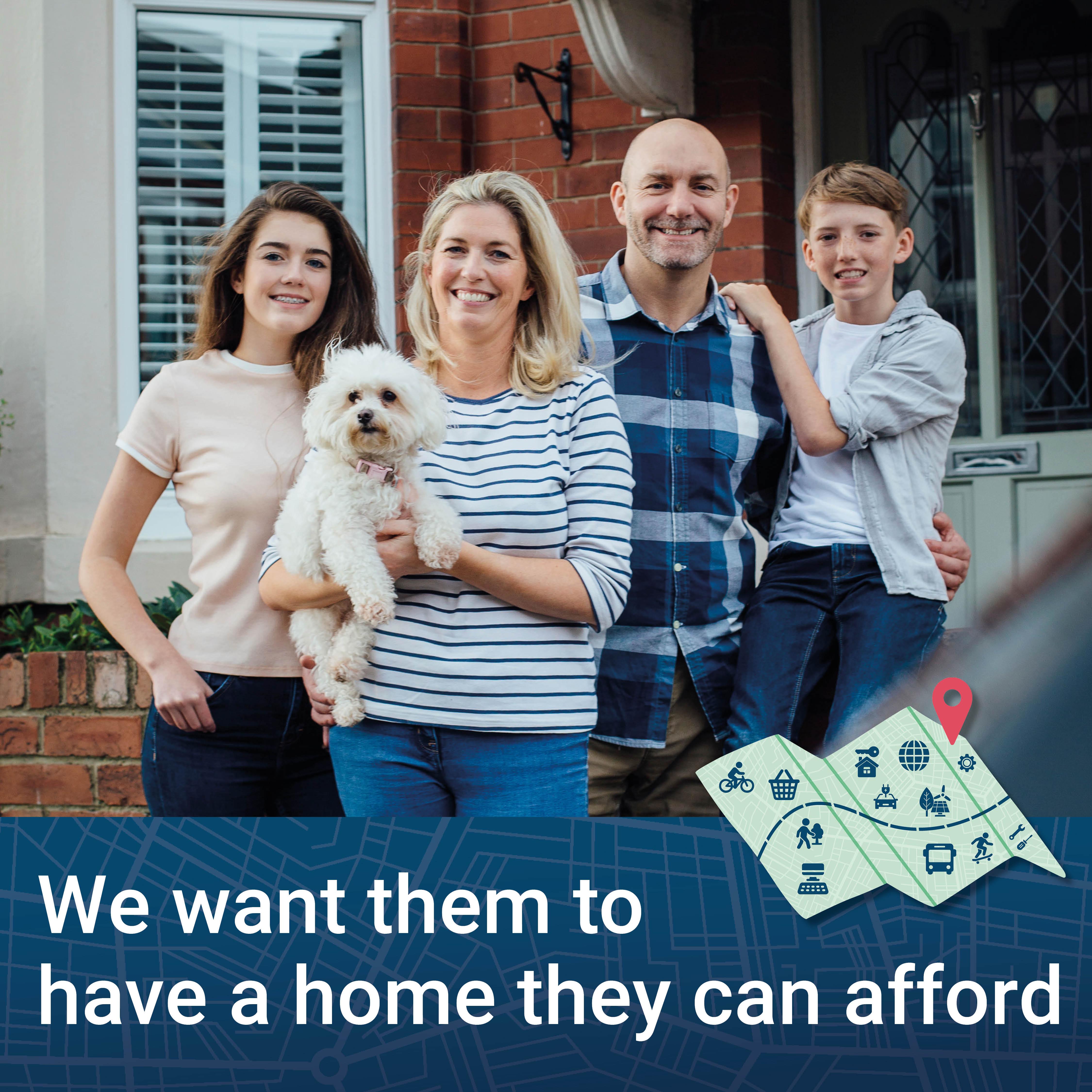 Family of four people and a dog in front of a house