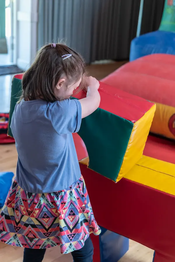 Girl playing in soft play area