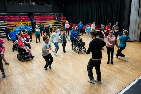 Arial view of a group taking part in a performing arts class