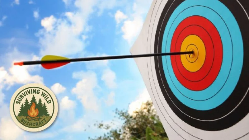 Arrow hitting the centre of a colourful archery target outdoors, with the Surviving Wild Bushcraft logo in the corner.