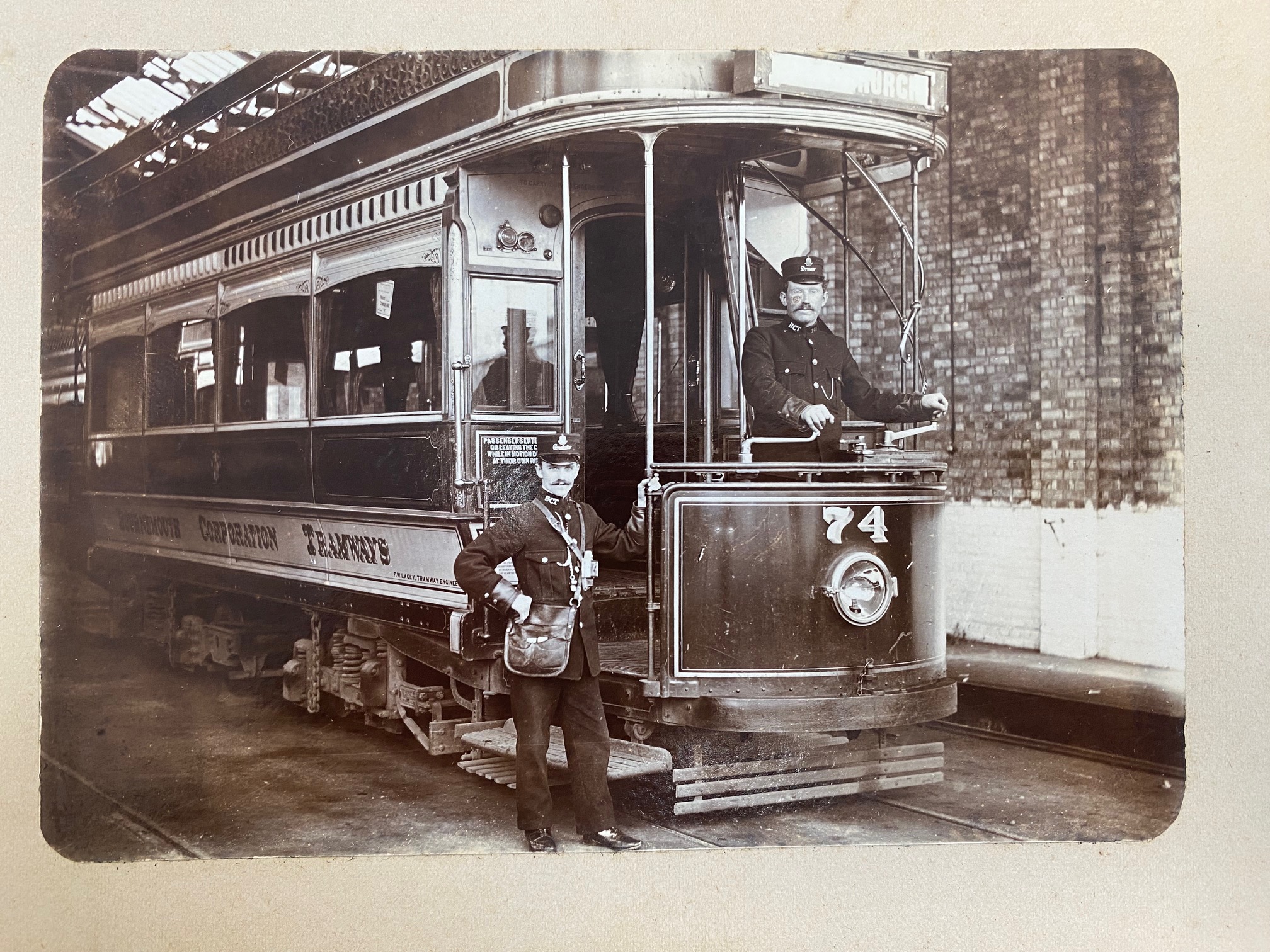 a black and white image of an old tram