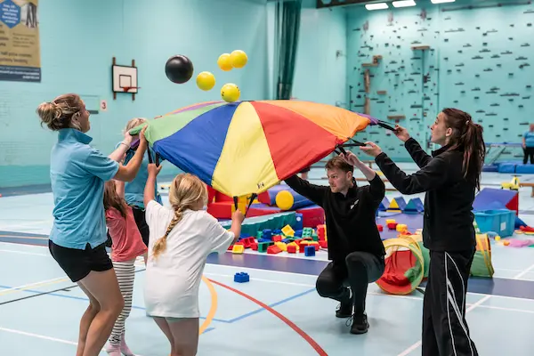 Group taking part in parachute games