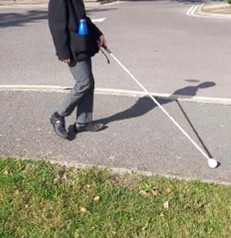 Young person using a walking cane