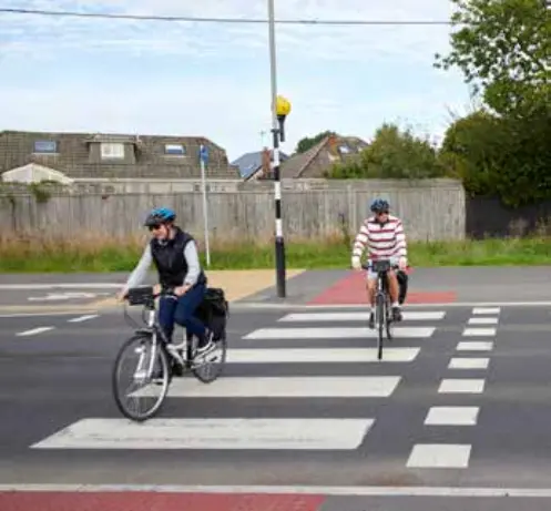 A new pedestrian crossing in Wimborne, Dorset, featuring tactile paving, clear road markings, and safety signage. The image highlights enhancements to walking infrastructure aimed at improving accessibility and safety