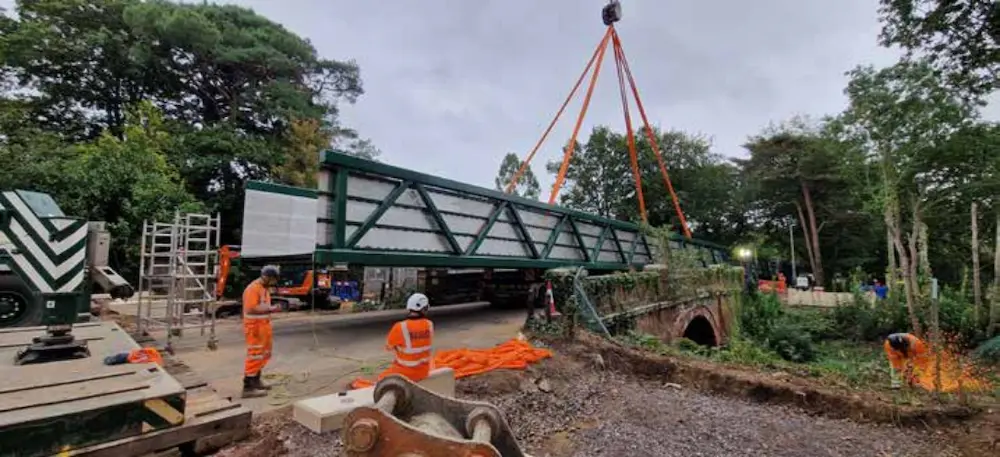 Side view of new active travel bridge being installed next to the road bridge on Glenferness Avenue, Bournemouth as part of one of the Transforming Travel corridors to deliver improved active travel infrastructure