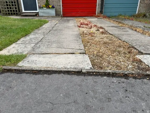Permeable driveway with a red garage door