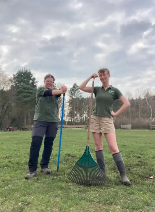 Two rangers standing next to each other.