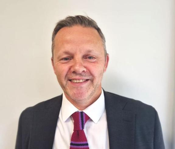 This is a headshot of Paul Dempsey, Executive Director of People and Children.
