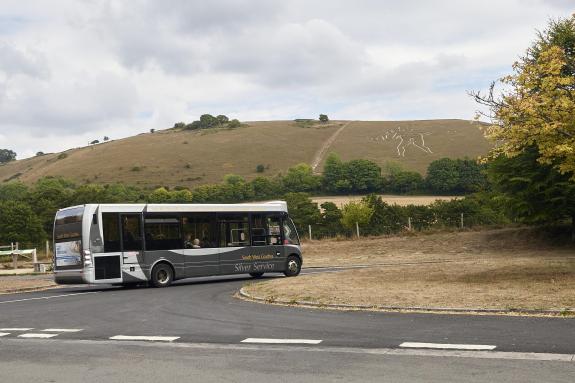 Bus driving on road in Cerne Abbas