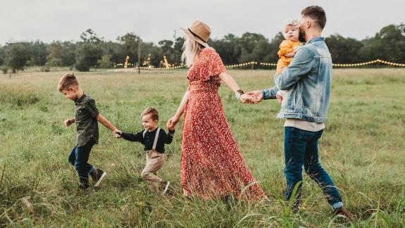 Family walking through field