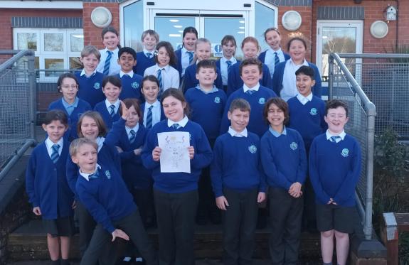 A large group of school children wearing royal blue jumpers and cardigans and grey trousers and skirts.