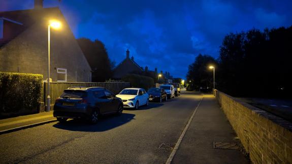 Street in Maiden Newton at night, with street lighting prominent
