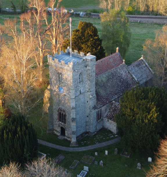 An arial view of Holy Rood Church, Shillingstone on a shady winter's day