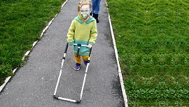 Young person using a walking cane